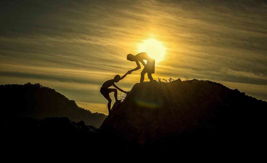Helping hand at sunset